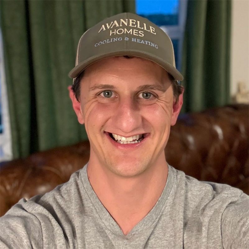Michael Murphy, the owner of Avanelle Homes, in an Avanelle Homes Cooling & Heating cap.